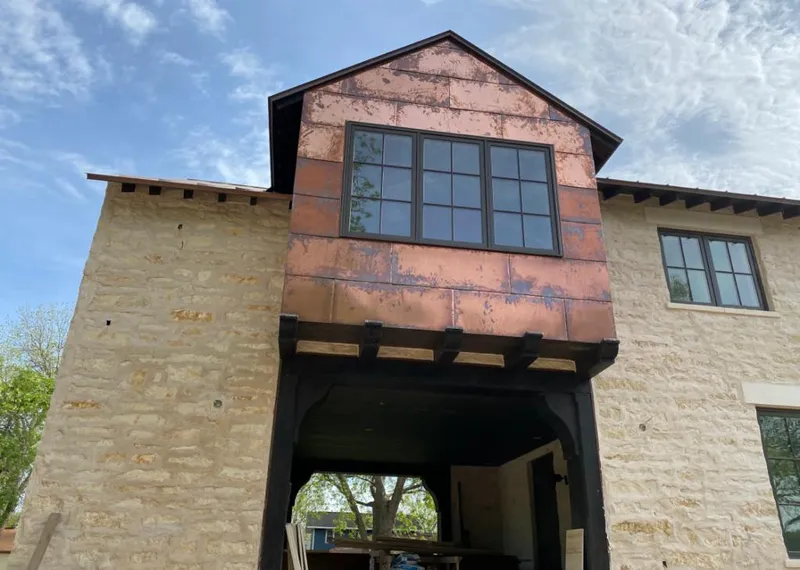 Copper metal panel facade on a stone building for Skylight Installation in Upper Merion